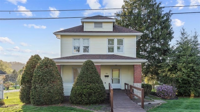304 Wylie Ave, Elizabeth Twp/Boro, PA 15037 - traditional style home featuring a porch, a front lawn, and a shingled roof