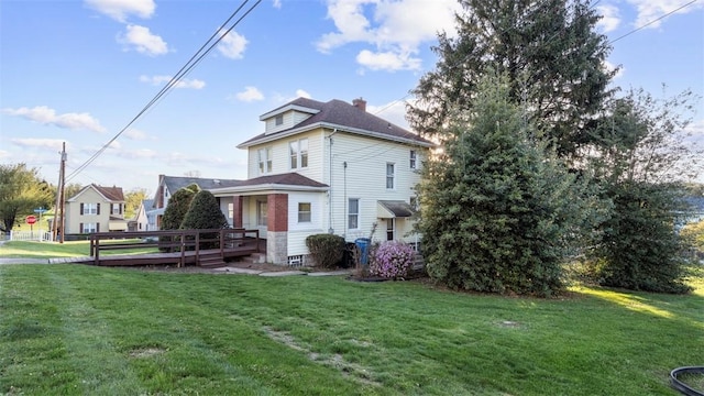 304 Wylie Ave, Elizabeth Twp/Boro, PA 15037 - view of front of home featuring a wooden deck, a front lawn, and a chimney