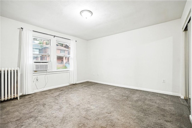 1334 Franklin Ave, Wilkinsburg, PA 15221 - empty room featuring radiator heating unit, carpet, and cooling unit
