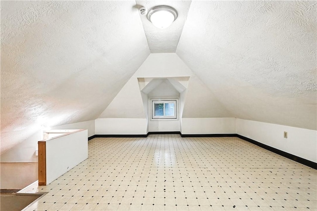 1334 Franklin Ave, Wilkinsburg, PA 15221 - additional living space featuring a textured ceiling and vaulted ceiling