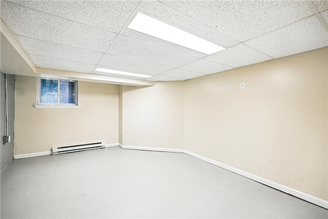 1334 Franklin Ave, Wilkinsburg, PA 15221 - finished basement featuring a baseboard radiator and a drop ceiling