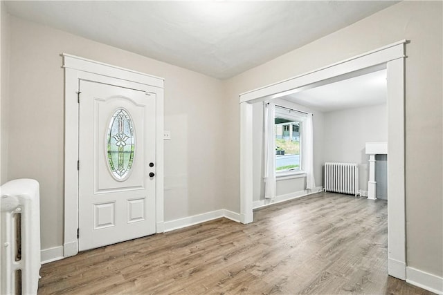 1334 Franklin Ave, Wilkinsburg, PA 15221 - entrance foyer with radiator heating unit and wood finished floors