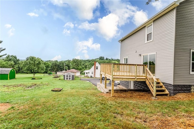 1451 W Pittsburgh St, East Huntingdon, PA 15683 - view of green lawn featuring a shed and a wooden deck