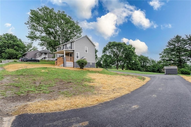 1451 W Pittsburgh St, East Huntingdon, PA 15683 - view of side of home with a lawn and stairs