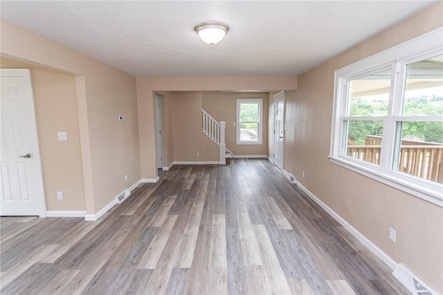 1451 W Pittsburgh St, East Huntingdon, PA 15683 - unfurnished room featuring wood finished floors and stairs