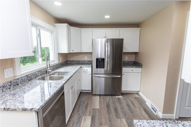 1451 W Pittsburgh St, East Huntingdon, PA 15683 - kitchen featuring stainless steel appliances, white cabinetry, light wood finished floors, and recessed lighting