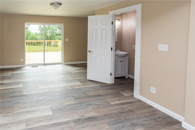 1451 W Pittsburgh St, East Huntingdon, PA 15683 - unfurnished room featuring wood finished floors and a sink