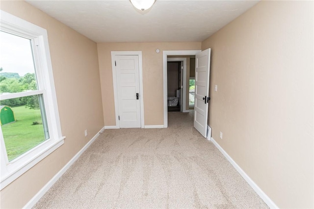 1451 W Pittsburgh St, East Huntingdon, PA 15683 - spare room featuring plenty of natural light and light carpet