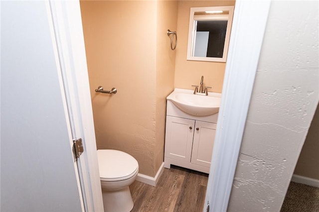 1451 W Pittsburgh St, East Huntingdon, PA 15683 - half bathroom featuring vanity and wood finished floors