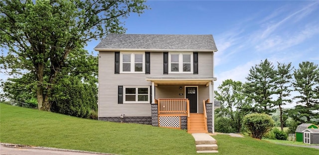 1451 W Pittsburgh St, East Huntingdon, PA 15683 - view of front facade featuring covered porch, a front lawn, a storage unit, and stairway