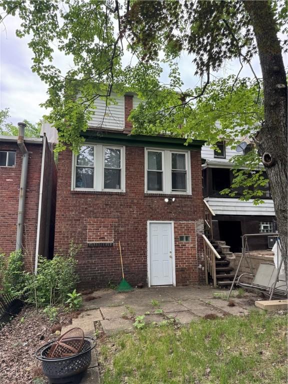 125 Frazier Ave, Stowe Twp, PA 15136 - back of house with a fire pit, brick siding, a patio area, and stairs