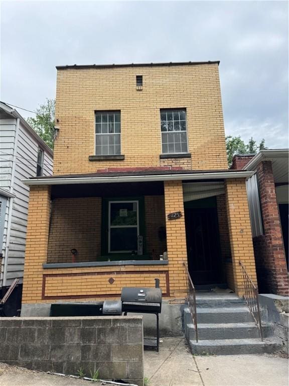 125 Frazier Ave, Stowe Twp, PA 15136 - back of property with brick siding and a porch