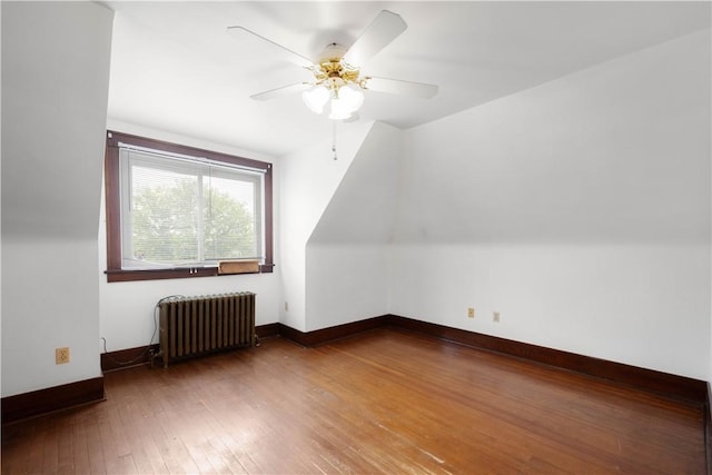 512 Gorgas St, Arlington, PA 15210 - bonus room featuring radiator heating unit, a ceiling fan, and hardwood / wood-style flooring