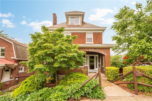 512 Gorgas St, Arlington, PA 15210 - view of front of home featuring brick siding and a chimney