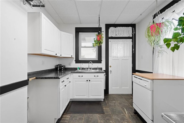 512 Gorgas St, Arlington, PA 15210 - kitchen with a drop ceiling, dishwasher, white cabinetry, dark stone finish floors, and dark countertops