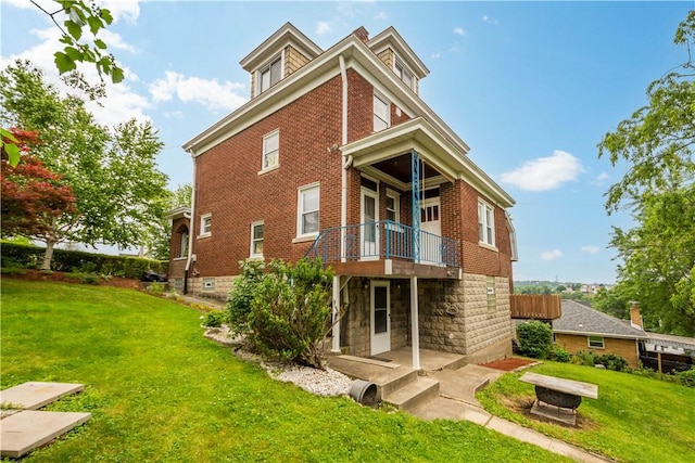 512 Gorgas St, Arlington, PA 15210 - back of property with brick siding and a lawn