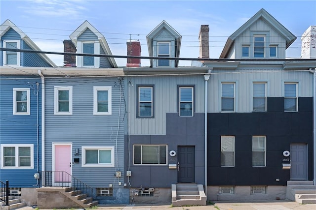 3817 Howley St, Lawrenceville, PA 15201 - townhome / multi-family property with entry steps and a chimney