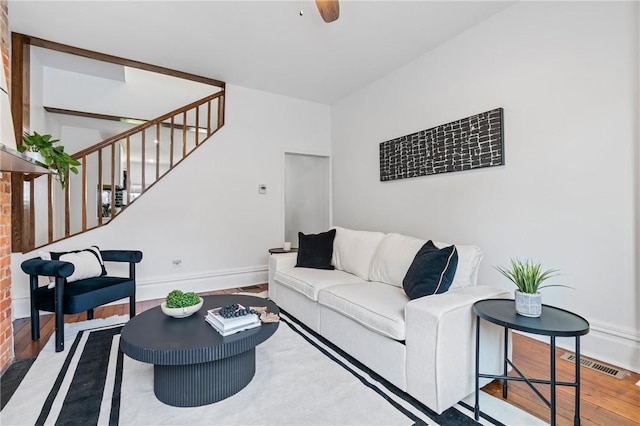 3817 Howley St, Lawrenceville, PA 15201 - living area with stairs, wood finished floors, and a ceiling fan