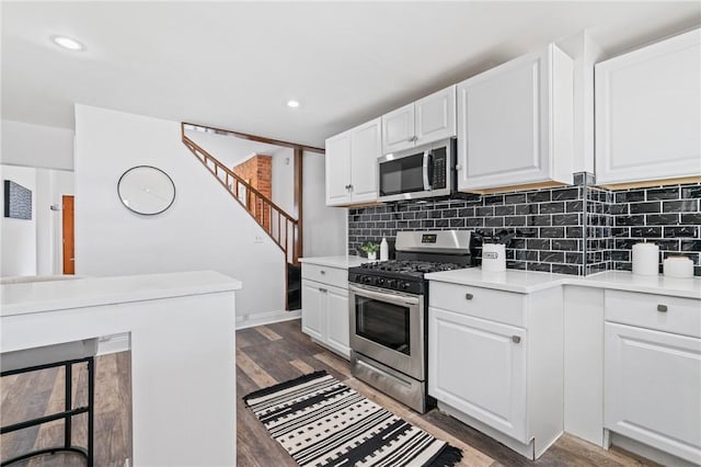 3817 Howley St, Lawrenceville, PA 15201 - kitchen featuring appliances with stainless steel finishes, tasteful backsplash, white cabinets, light countertops, and recessed lighting