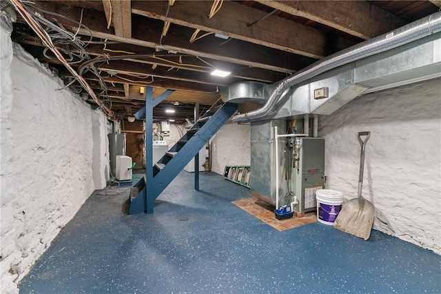 3817 Howley St, Lawrenceville, PA 15201 - unfinished below grade area featuring washer / dryer, stairs, heating unit, and water heater