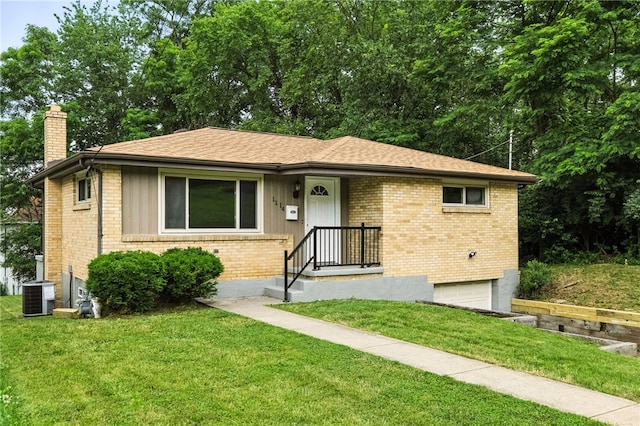 1114 Ellopia St, Chartiers City, PA 15204 - view of front of property with a garage, a chimney, a front lawn, brick siding, and roof with shingles