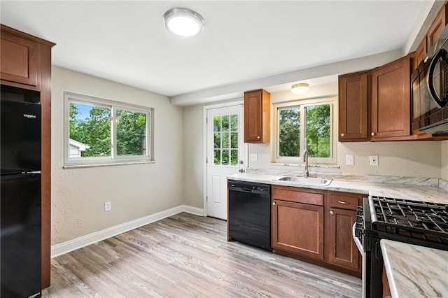 1114 Ellopia St, Chartiers City, PA 15204 - kitchen featuring black appliances, plenty of natural light, and light wood-style flooring