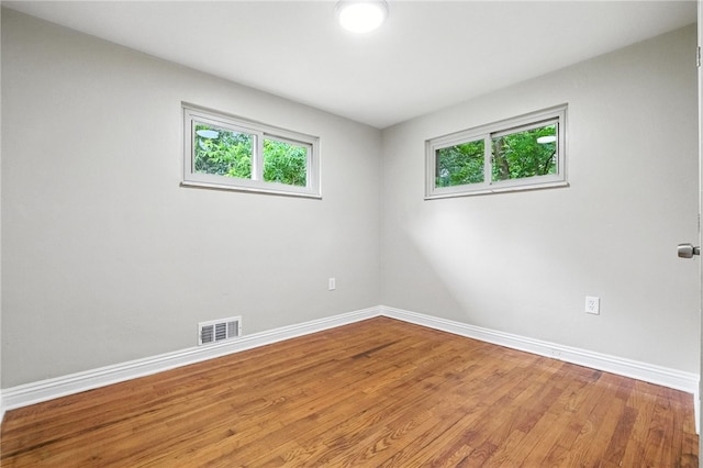 1114 Ellopia St, Chartiers City, PA 15204 - spare room featuring healthy amount of natural light and wood finished floors