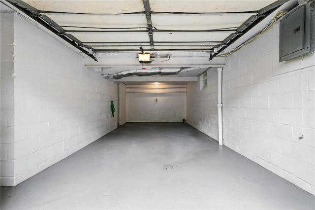 1114 Ellopia St, Chartiers City, PA 15204 - garage with a garage door opener, concrete block wall, and electric panel