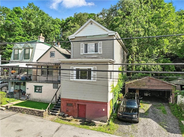 2505 Gable St, South Side, PA 15210 - view of front of house with view of scattered trees and gravel driveway
