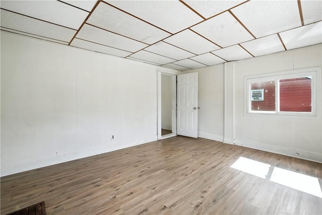 2505 Gable St, South Side, PA 15210 - empty room with wood finished floors and a drop ceiling