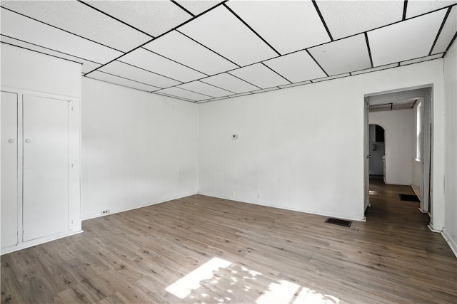 2505 Gable St, South Side, PA 15210 - empty room with arched walkways and wood finished floors