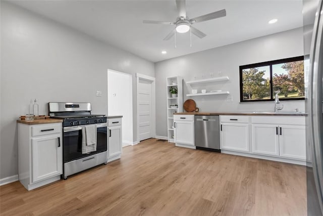 450 Penn St, Baldwin Boro, PA 15227 - kitchen featuring stainless steel appliances, open shelves, light wood-style floors, white cabinets, and recessed lighting