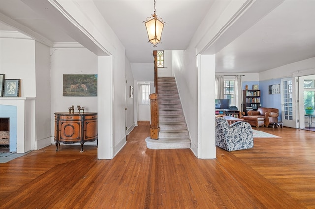 6517 Aylesboro Ave, Squirrel Hill, PA 15217 - staircase featuring wood finished floors, plenty of natural light, and a fireplace