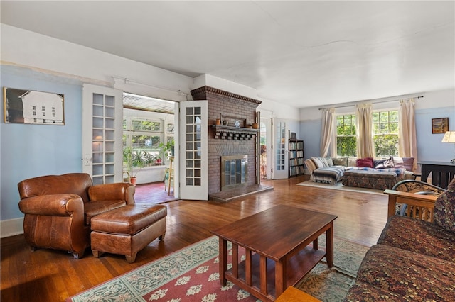 6517 Aylesboro Ave, Squirrel Hill, PA 15217 - living room featuring wood finished floors and a brick fireplace