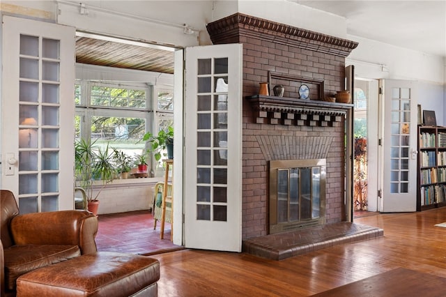 6517 Aylesboro Ave, Squirrel Hill, PA 15217 - living area featuring a fireplace and wood finished floors