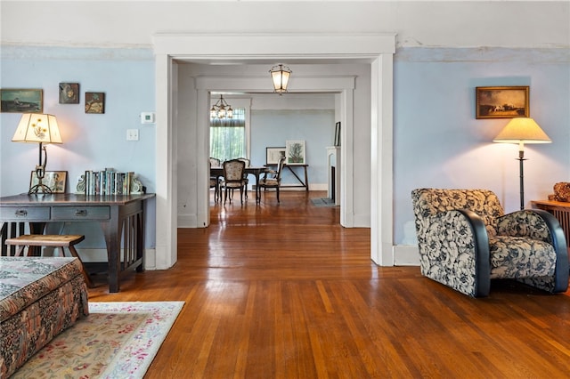 6517 Aylesboro Ave, Squirrel Hill, PA 15217 - hallway featuring wood finished floors and a chandelier