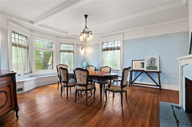 6517 Aylesboro Ave, Squirrel Hill, PA 15217 - dining space featuring a chandelier, wood finished floors, a brick fireplace, beam ceiling, and crown molding