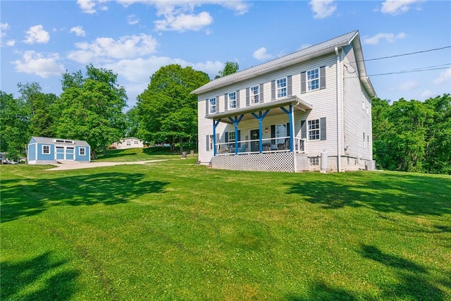 27 Richeyville Rd, Centerville, PA 15358 - rear view of house featuring covered porch and a lawn