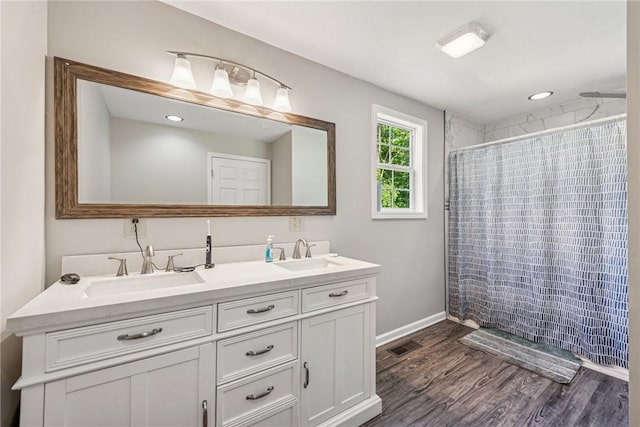 27 Richeyville Rd, Centerville, PA 15358 - bathroom featuring double vanity, a shower with shower curtain, and wood finished floors