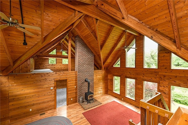 117 Oak Dr, Forward Twp But, PA 16033 - unfurnished living room featuring wood ceiling, ceiling fan, healthy amount of natural light, wood finished floors, and wooden walls