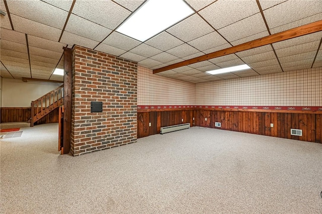 117 Oak Dr, Forward Twp But, PA 16033 - carpeted spare room with baseboard heating, a paneled ceiling, stairway, and wainscoting