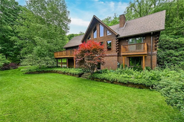 117 Oak Dr, Forward Twp But, PA 16033 - rear view of property featuring log siding, a chimney, and a yard