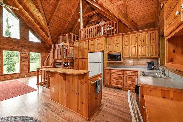 117 Oak Dr, Forward Twp But, PA 16033 - kitchen featuring black microwave, a wooden ceiling with exposed beams, light countertops, high vaulted ceiling, and light wood-type flooring