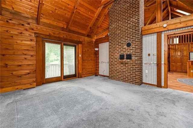 117 Oak Dr, Forward Twp But, PA 16033 - unfurnished living room with a wooden ceiling with exposed beams, wooden walls, carpet floors, and high vaulted ceiling
