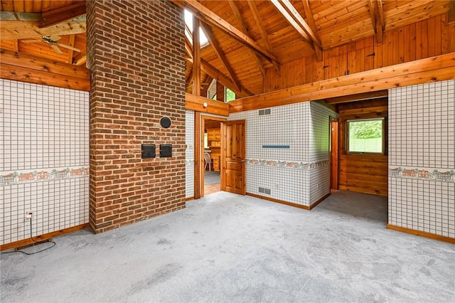 117 Oak Dr, Forward Twp But, PA 16033 - carpeted empty room with a wooden ceiling with exposed beams, wooden walls, and high vaulted ceiling