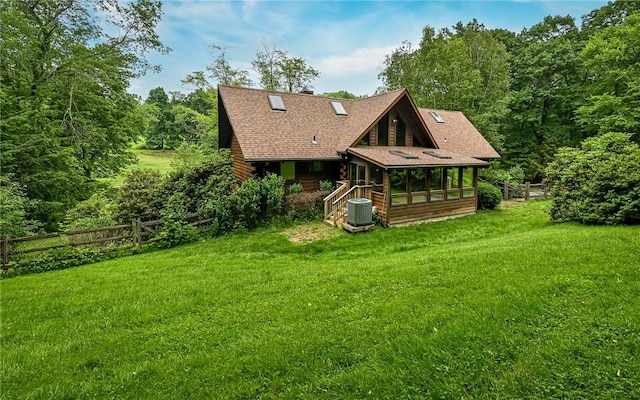 117 Oak Dr, Forward Twp But, PA 16033 - rear view of property featuring a sunroom, a chimney, and roof with shingles