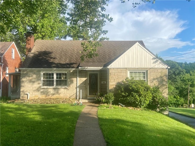 175 Crescent Hills Rd, Penn Hills, PA 15235 - view of front of property with a front yard, stone siding, board and batten siding, and a shingled roof
