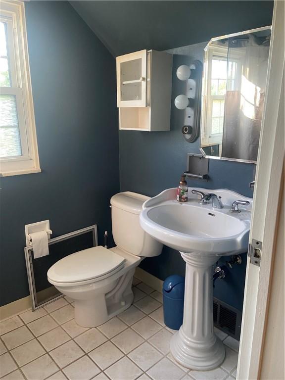 175 Crescent Hills Rd, Penn Hills, PA 15235 - bathroom with tile patterned flooring and lofted ceiling