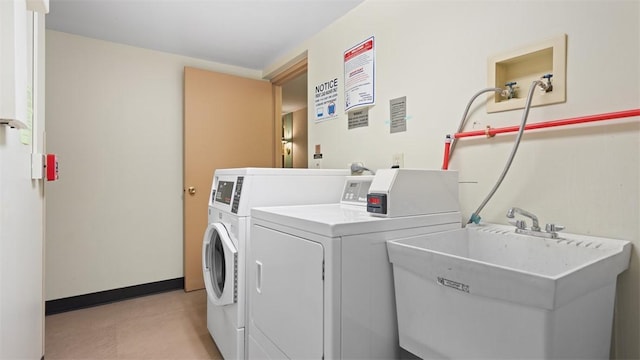220 N Dithridge St Unit 1001, Oakland, PA 15213 - communal laundry room featuring washing machine and dryer and baseboards