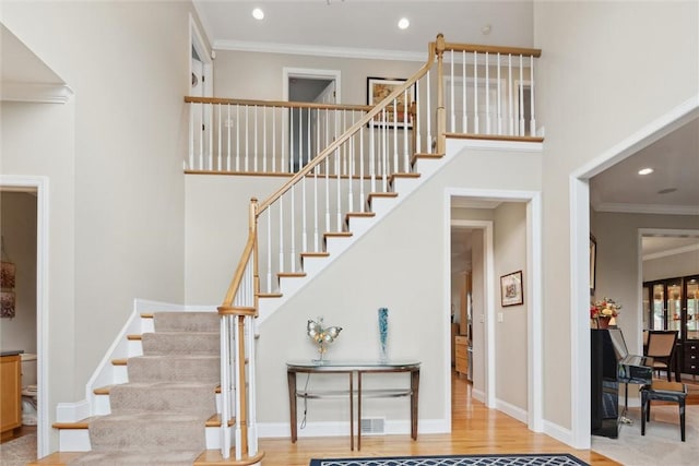 1500 Zenith Ct, Upper St Clair, PA 15241 - stairway featuring a towering ceiling, recessed lighting, ornamental molding, and wood finished floors